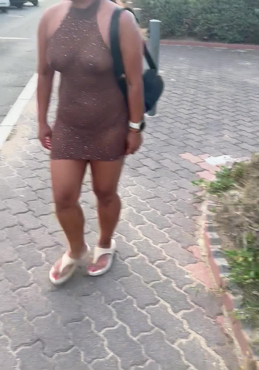 Video by constantlyhornyH with the username @constantlyhornyH, who is a verified user,  August 26, 2023 at 1:29 PM. The post is about the topic amateur wife sharing only and the text says 'wifey wearing a sheer dress on our way to dinner while on holiday 😜'