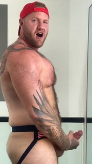 Video by Nickplus33 with the username @Nickplus33, who is a verified user,  March 15, 2024 at 2:31 AM and the text says '#beefy #dilf #ginger #hung #massivecock #jockstrap #caps #hairy #chain'