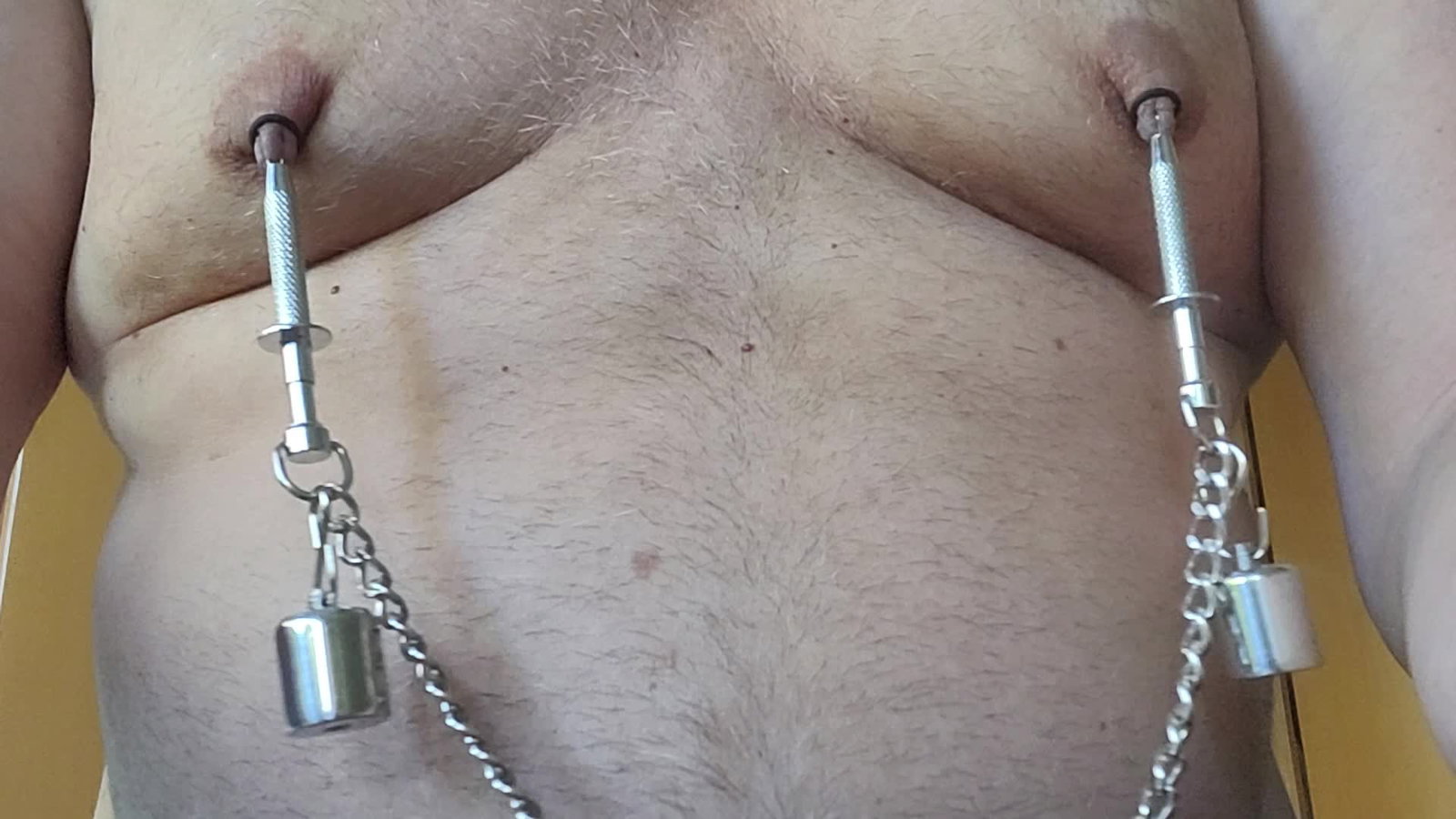 Video by Chastity Chub with the username @chastity-chub,  June 16, 2023 at 12:56 PM. The post is about the topic Male Chastity and the text says 'These clamps hurt a lot by themselves. But you even can increase the pain with weights and wiggling'