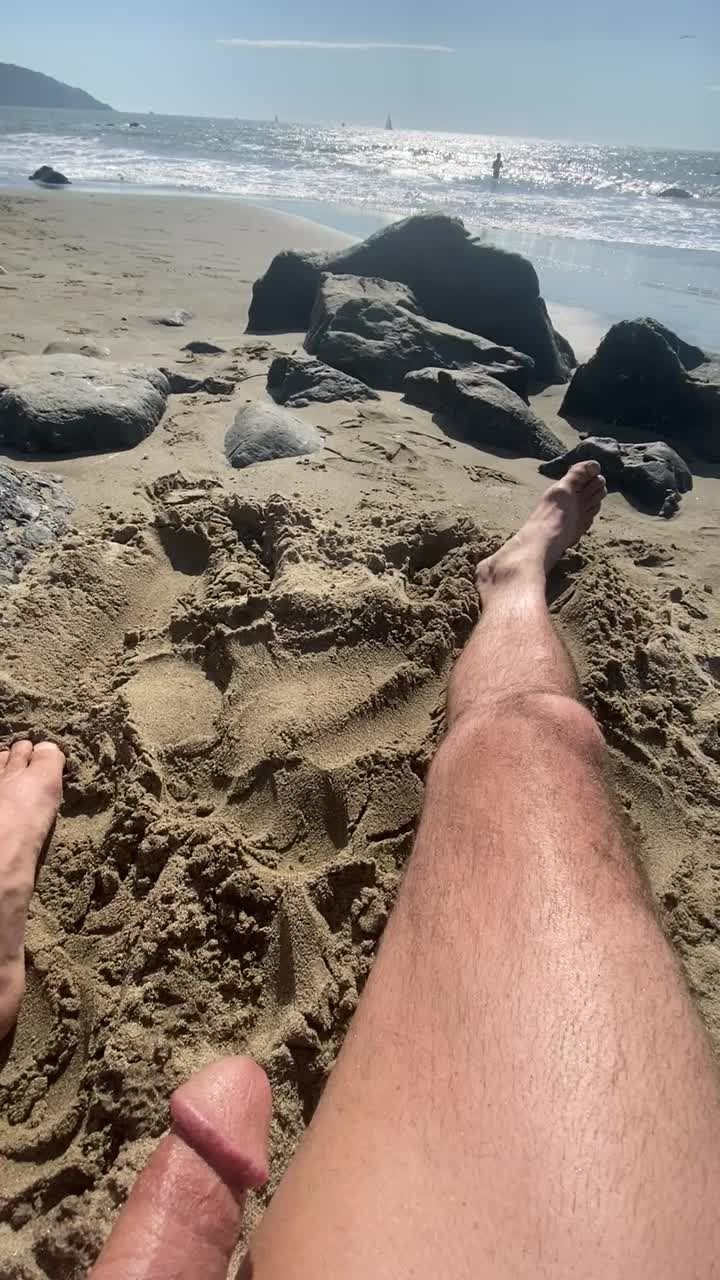 Shared Video by Exxxhibitionist with the username @Exxxhibitionist,  May 13, 2024 at 10:26 AM and the text says '#publicmasturbation #nudebeach'