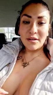 Touching her boobs in a car